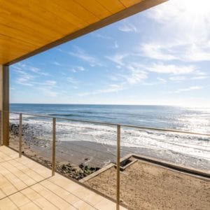 Contemporary remodel patio with ocean view by JRP Design and Remodel in Malibu