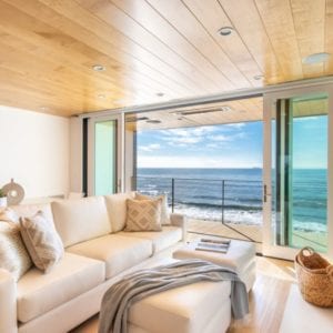 Contemporary family room remodel with an ocean view by JRP Design and Remodel in Malibu