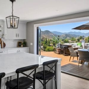 All white transitional kitchen remodel with bi fold doors in Westlake Village By JRP Design and Remodel