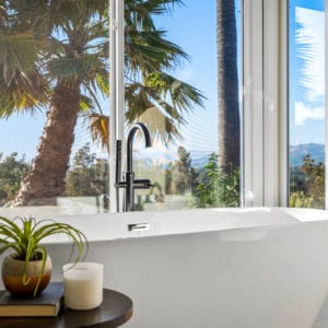 Master bathroom soaking tub with gorgeous view in Camarillo by JRP Design and Remodel