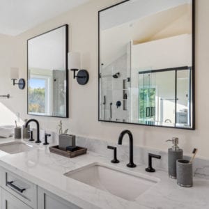 Master bath vanity with black matte fixtures, grey cabinets, and marble quartz in Camarillo by JRP Design and Remodel
