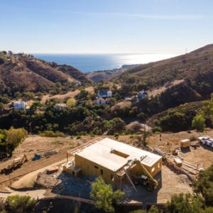 Framing with walls construction photo of Carrita Seaview Malibu custom home by JRP Design and Remodel