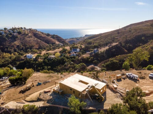 Framing with walls construction photo of Carrita Seaview Malibu custom home by JRP Design and Remodel