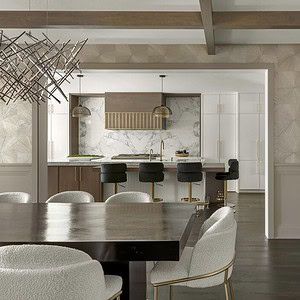 A modern dining area with a dark wooden table and white cushioned chairs overlooks a sleek kitchen featuring a marble backsplash, bar stools, wooden accents, and contemporary light fixtures, all exuding sophisticated glamour.