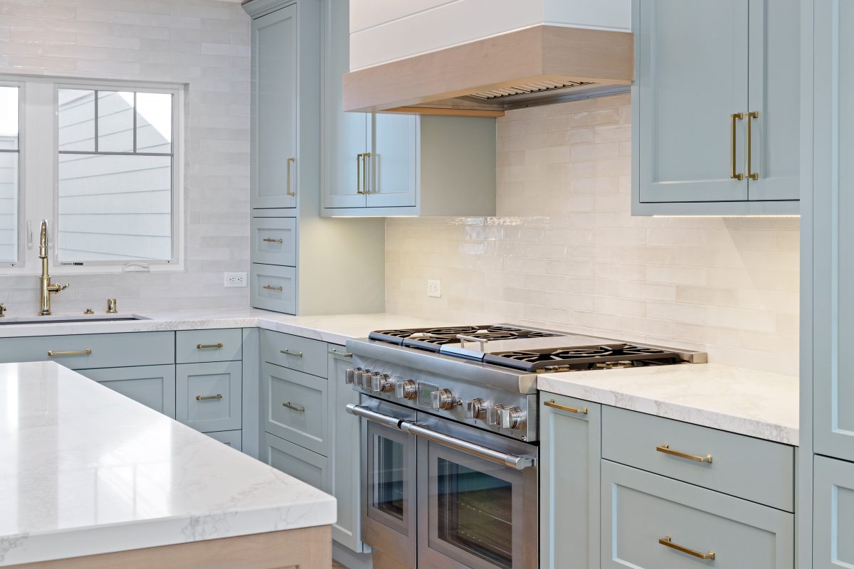 Modern Coastal Remodel in Channel Islands reimagined with a light blue kitchen by JRP Design and Remodel.