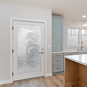 In a California coastal home reimagined by JRP Design and Remodel, with a glass door from Sans Soucie.