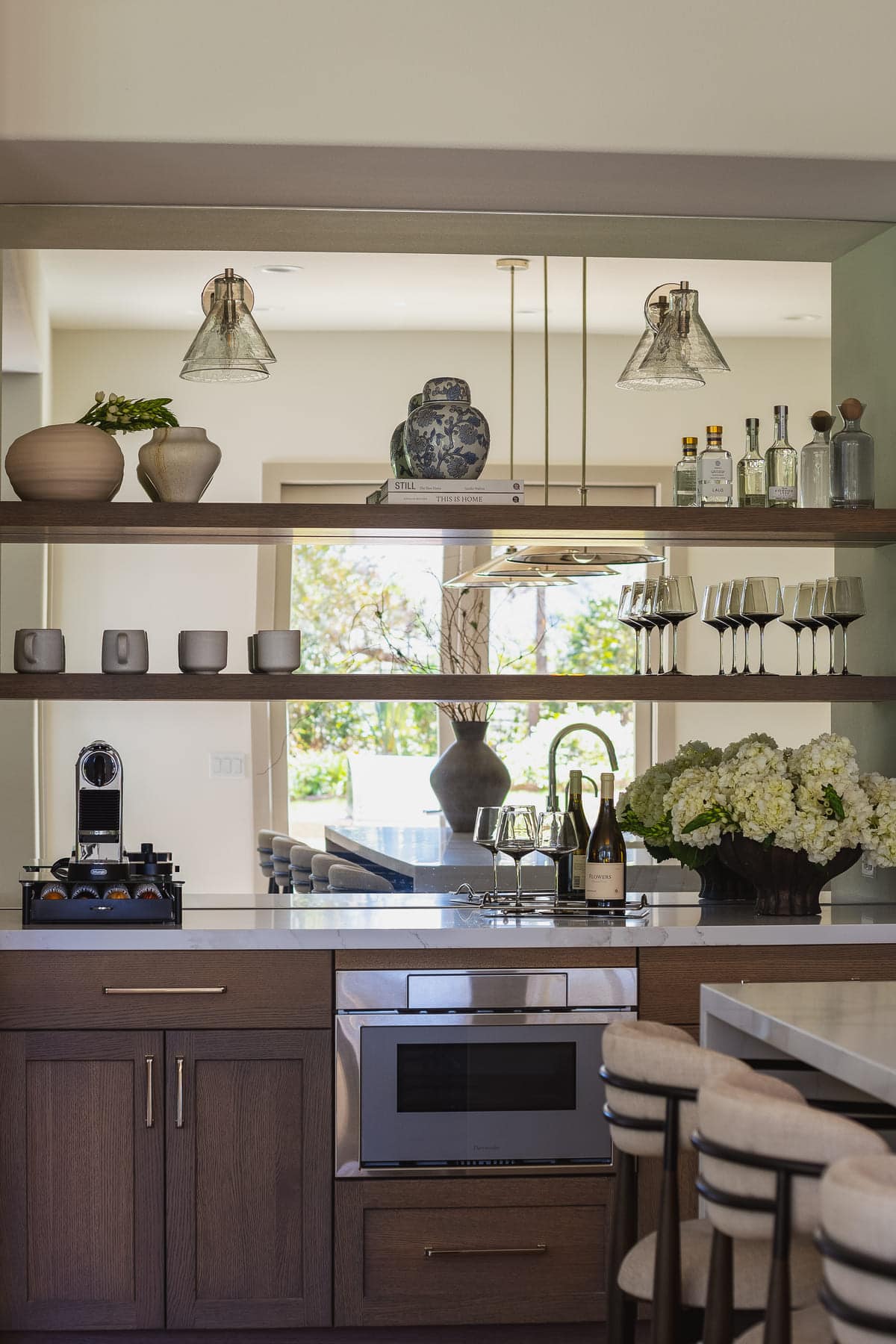 Perfectly Polished Kitchen remodel featuring a large island, modern coffee bar, sleek cabinetry and polished nickel accents, by JRP Design and Remodel.
