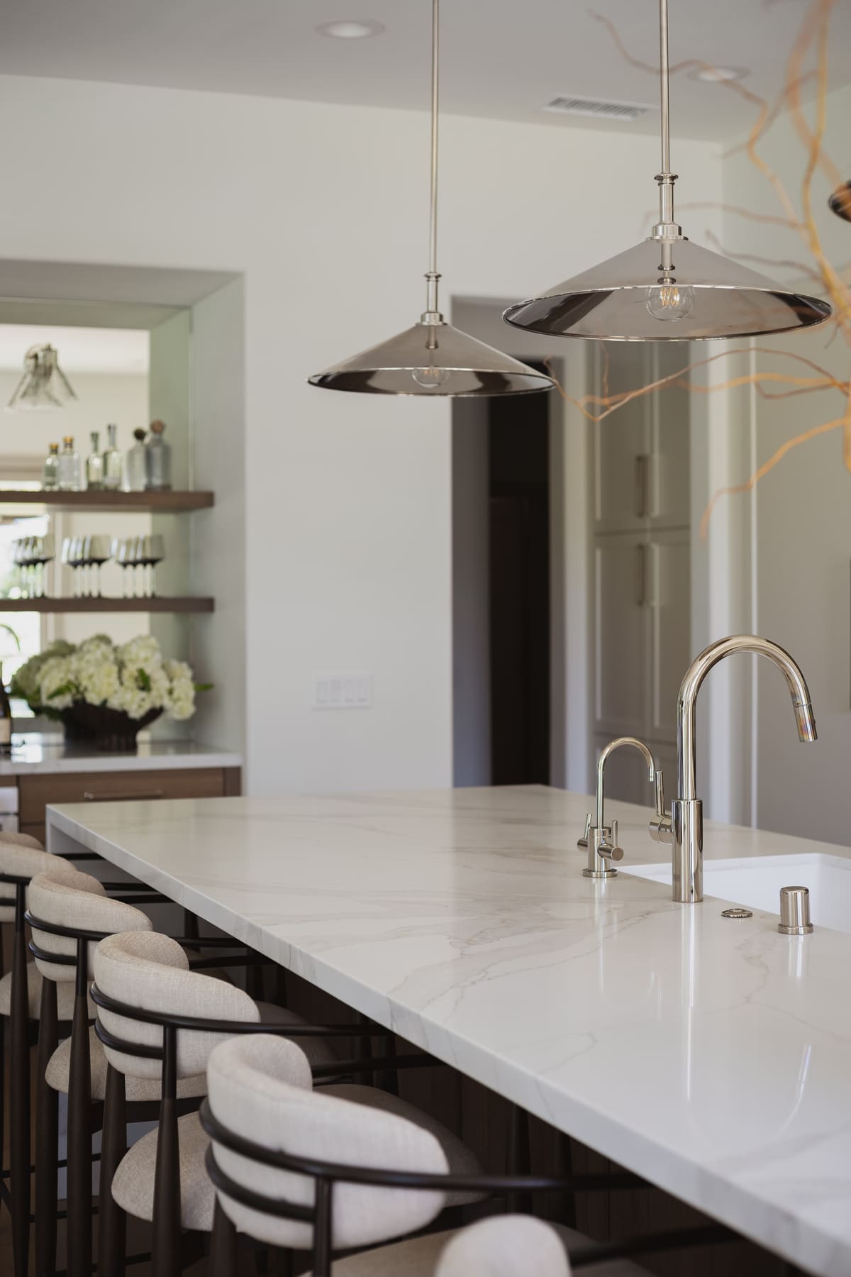 Perfectly Polished Kitchen remodel featuring a large island, modern coffee bar, sleek cabinetry and polished nickel accents, by JRP Design and Remodel.