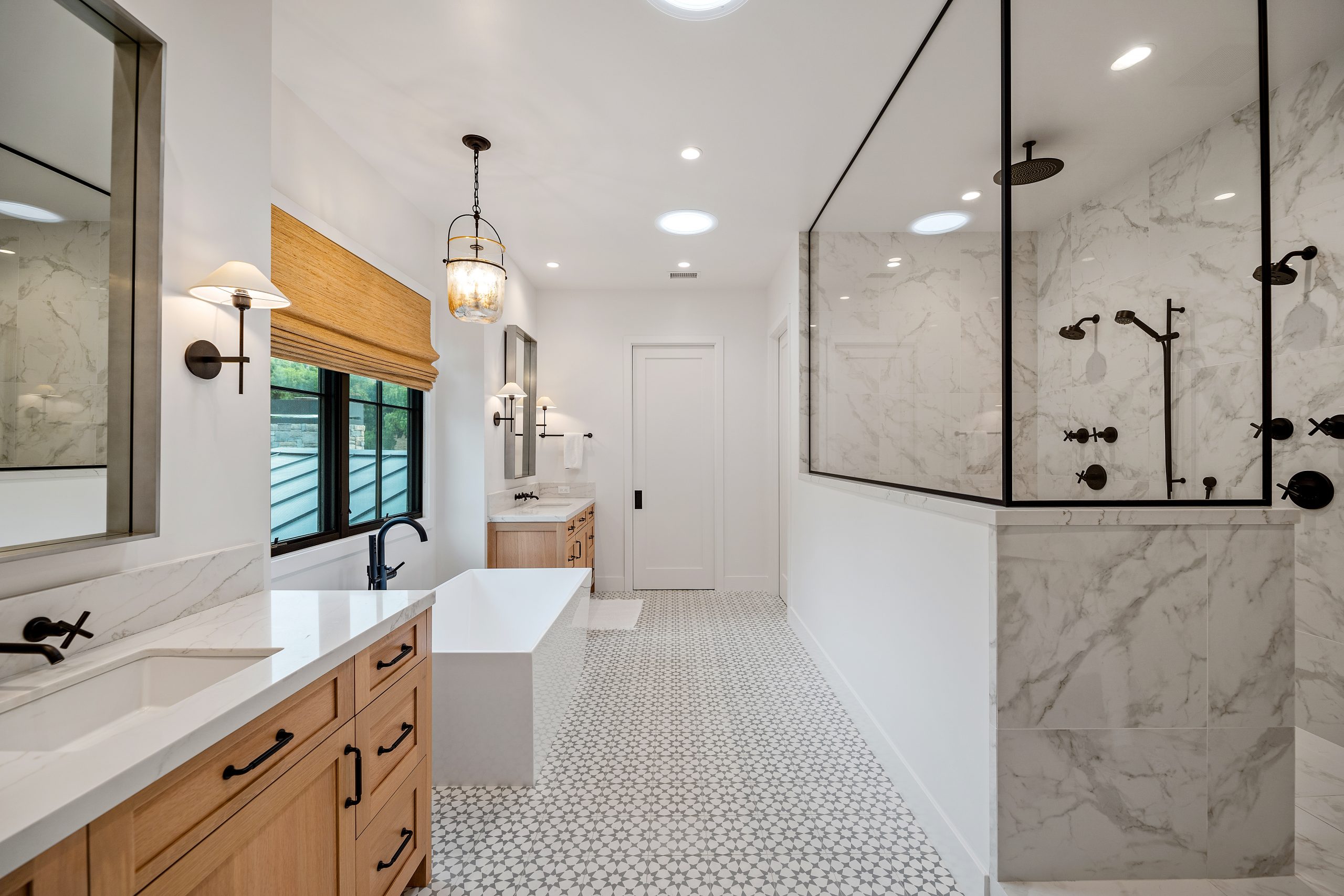 Spacious modern farmhouse bathroom with walk-in shower and wooden accents.