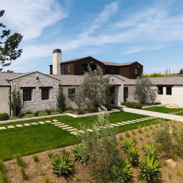 A ranch home, Salto Canyon Exterior Transformation by JRP Design and Remodel.